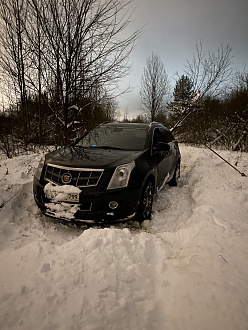 Вытащить из снежного плена вытащить застрявшую машину Cadillac SRX